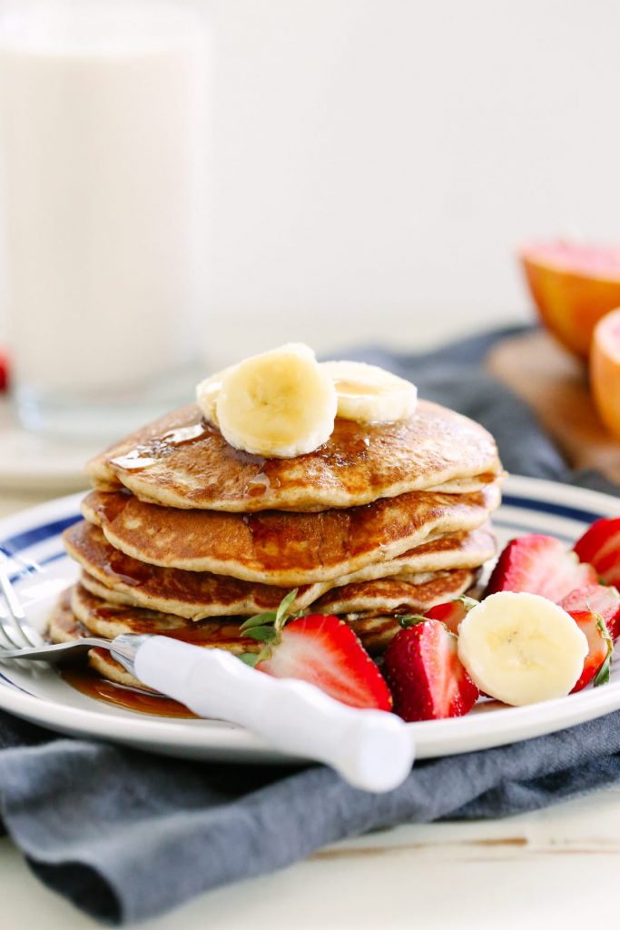 From scratch whole wheat pancakes that taste amazing! No boxed ingredients, just healthy real food. Love this. Make in advance and freeze the extras for busy mornings.