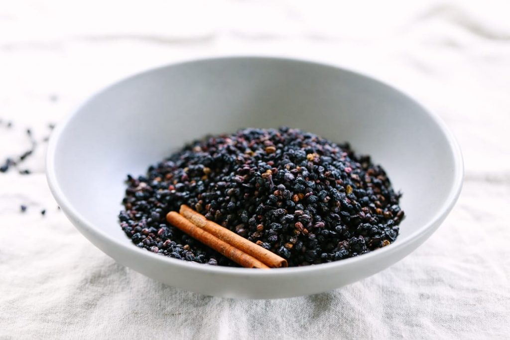 How to make the BEST homemade elderberry syrup. Plus, this recipe saves so much money when compared to purchasing immune-boosting elderberry syrup from the store. You can take this via a spoon or mix it in a smoothie.