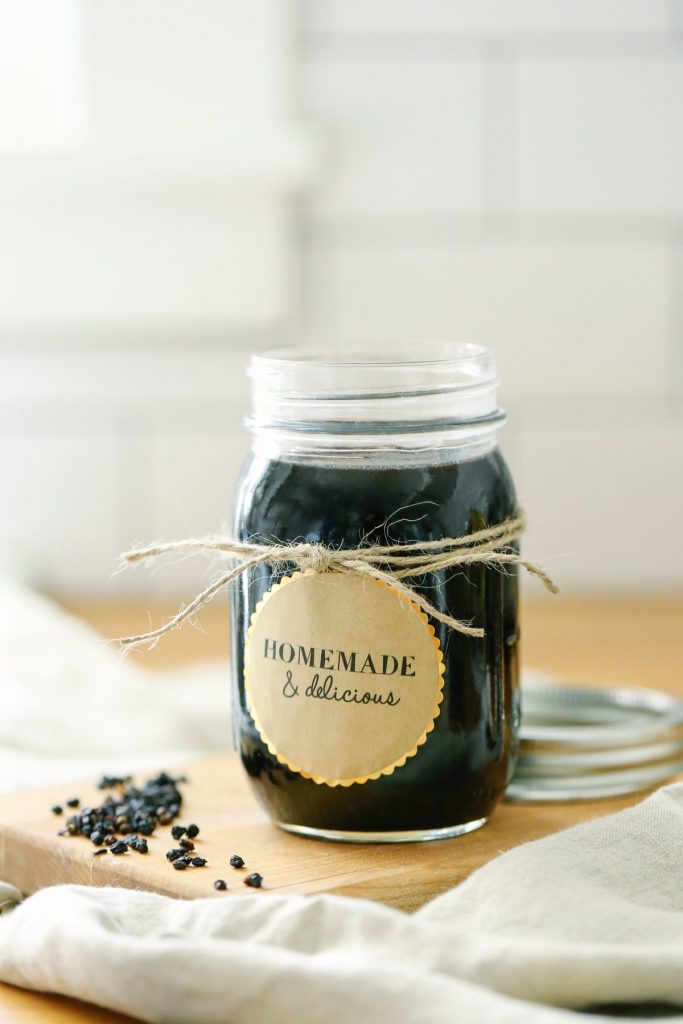 How to make the BEST homemade elderberry syrup. Plus, this recipe saves so much money when compared to purchasing immune-boosting elderberry syrup from the store. You can take this via a spoon or mix it in a smoothie.