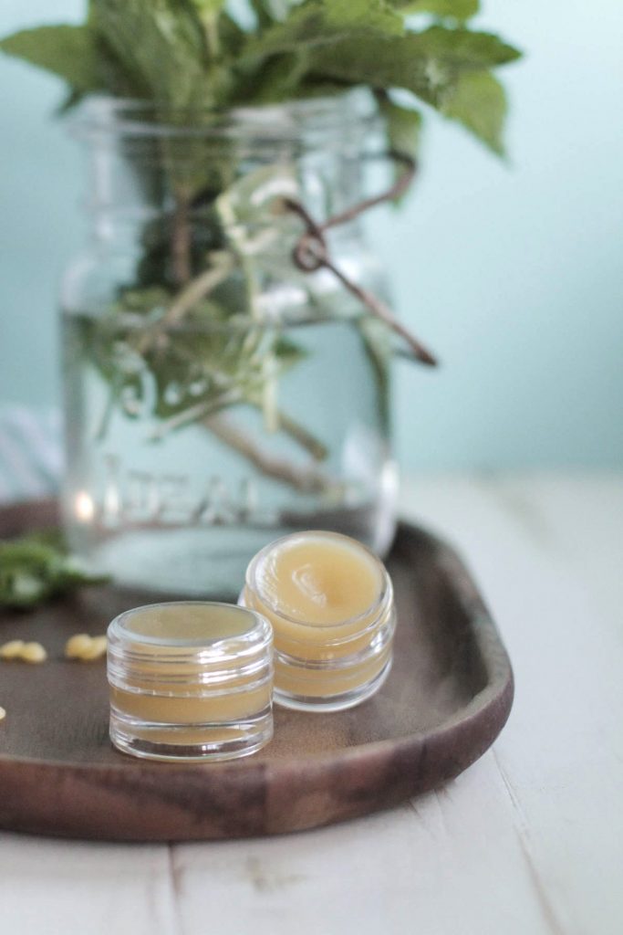 DIY Homemade Peppermint Lip Balm that's soft on the lips and moisturizes. Plus, you can use this lip balm as lotion or headache relief!