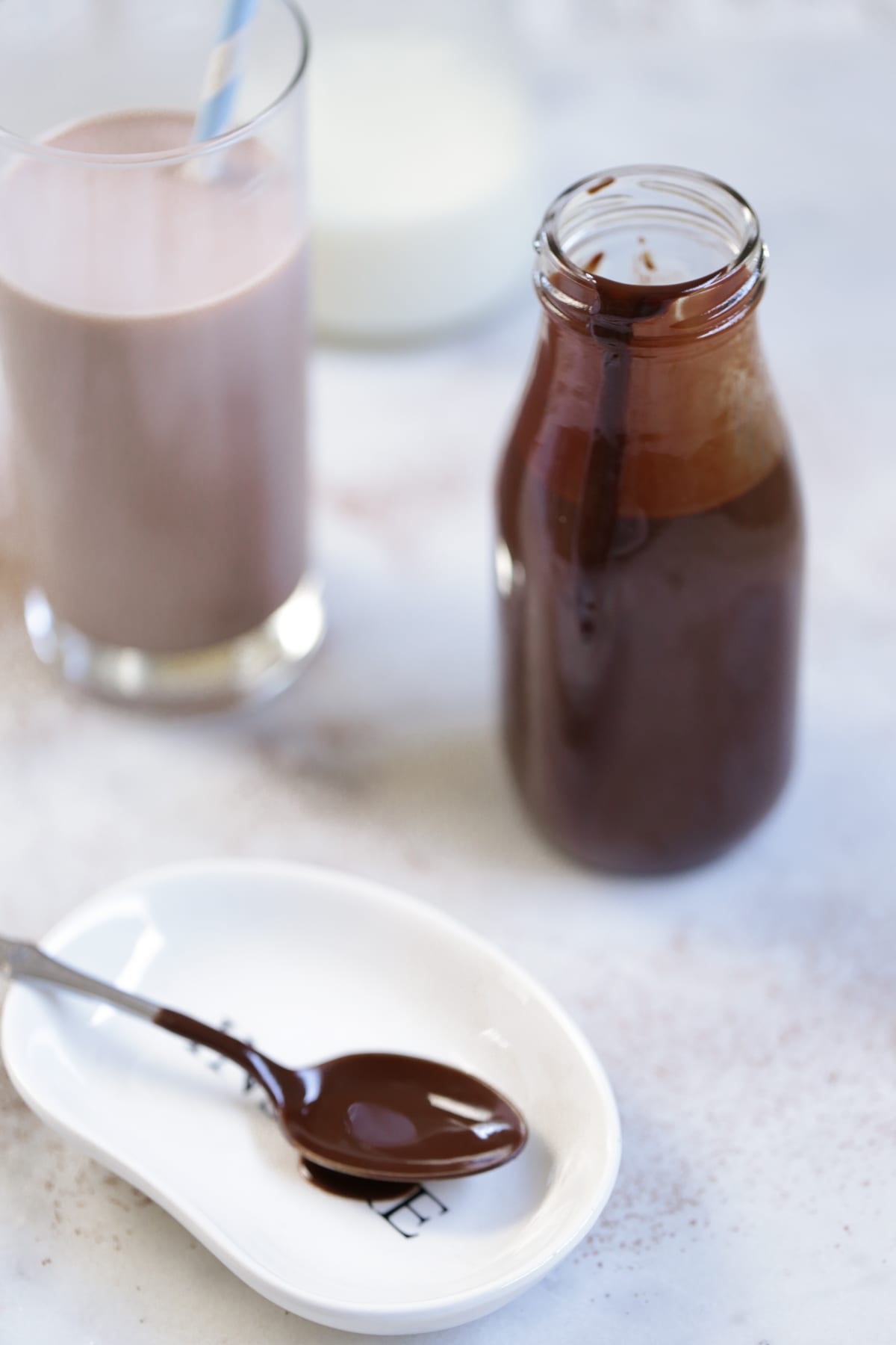 Homemade Chocolate Milk Syrup without refined sugars or artificial colors. The healthy, fun, and easy way to do chocolate milk. 