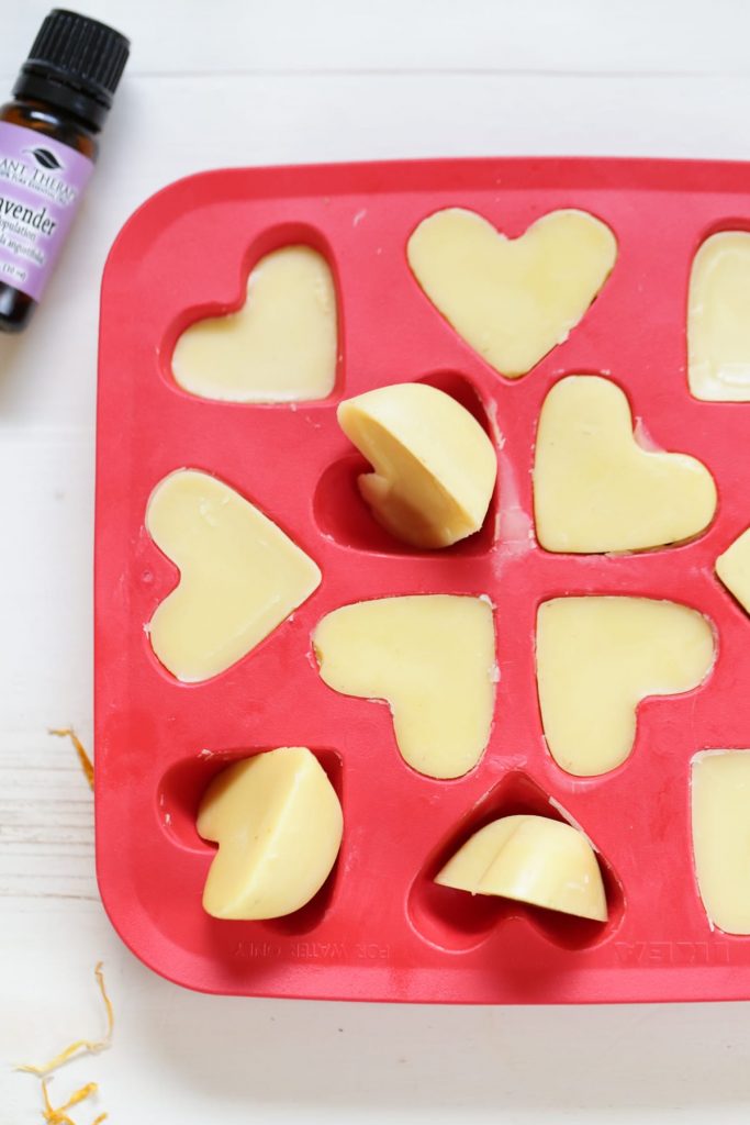 DIY Soothing Lotion Bars! These simple, little bars are the perfect lotion bars for soothing stressed, tired, burned, or even acne-scared skin. They also make the perfect little gift--just add a few to a mason jar.