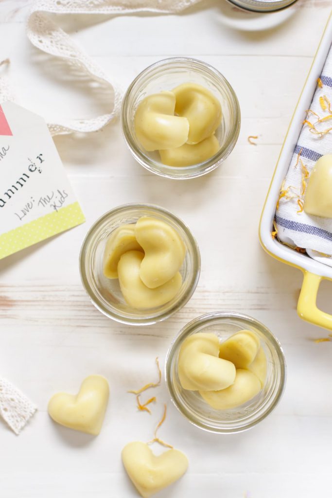 DIY Soothing Lotion Bars! These simple, little bars are the perfect lotion bars for soothing stressed, tired, burned, or even acne-scared skin. They also make the perfect little gift--just add a few to a mason jar.