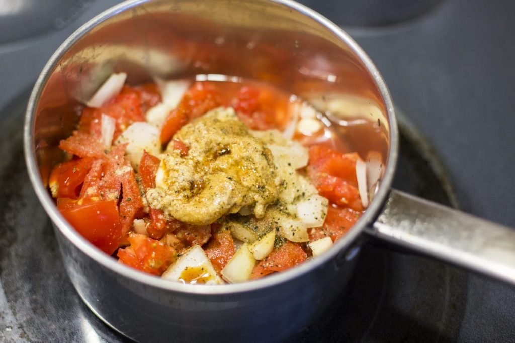 Fresh homemade ketchup without the nasty ingredients or processed sugar! Just place the ingredients in the pan, cook, and blend!