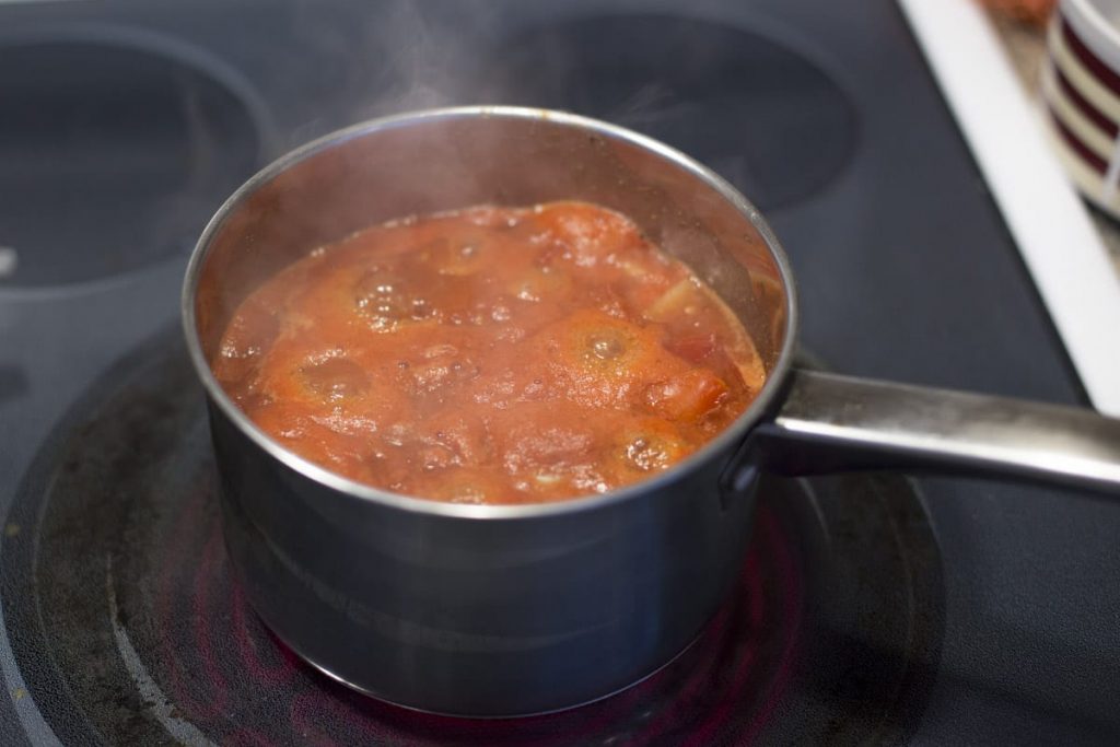 Fresh homemade ketchup without the nasty ingredients or processed sugar! Just place the ingredients in the pan, cook, and blend!