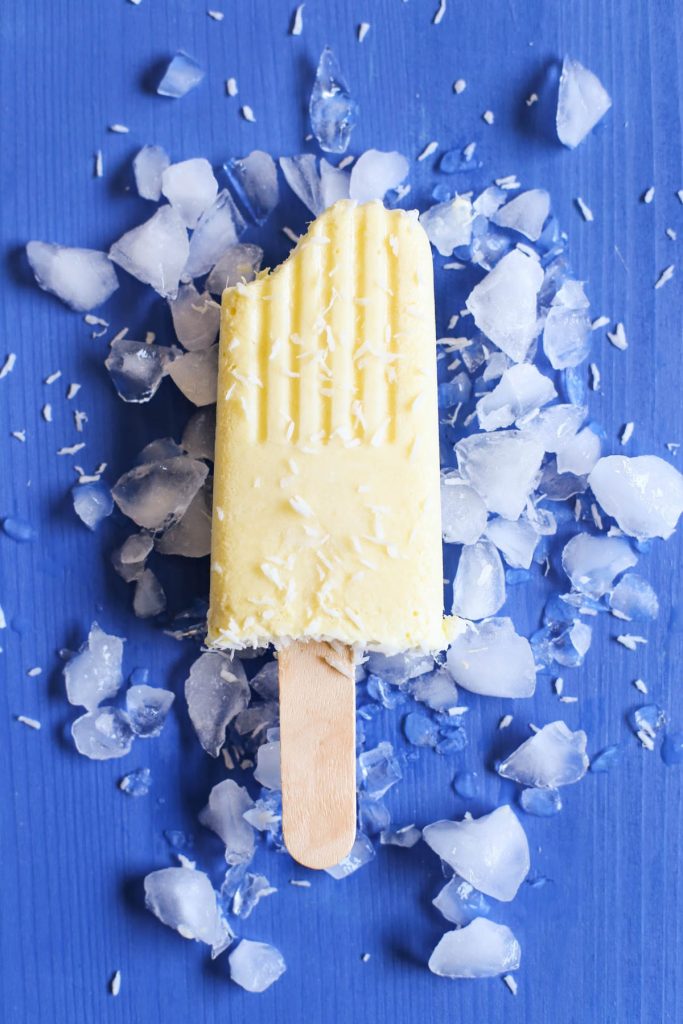 Pina Colada Popsicles. Only TWO ingredients! 100% vegan, gluten-free, and dairy-free. No nasty ingredients or sweeteners. Just blend, pour, and enjoy. So easy. Family-friendly.