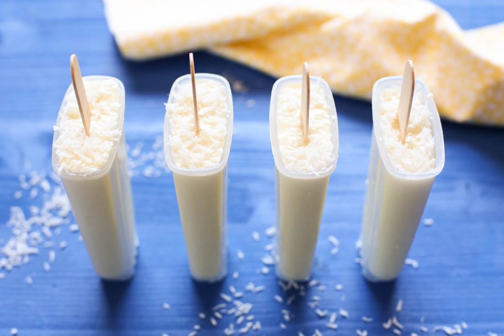 Pina Colada Popsicles. Only TWO ingredients! 100% vegan, gluten-free, and dairy-free. No nasty ingredients or sweeteners. Just blend, pour, and enjoy. So easy. Family-friendly.