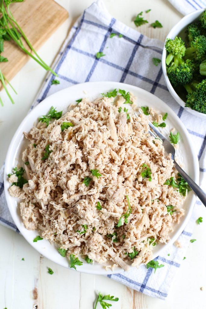 How to make super easy crock-pot shredded chicken using a whole chicken! Save money and time every week with this simple prep day method. Plus, ideas for using shredded chicken for quick, healthy meals!