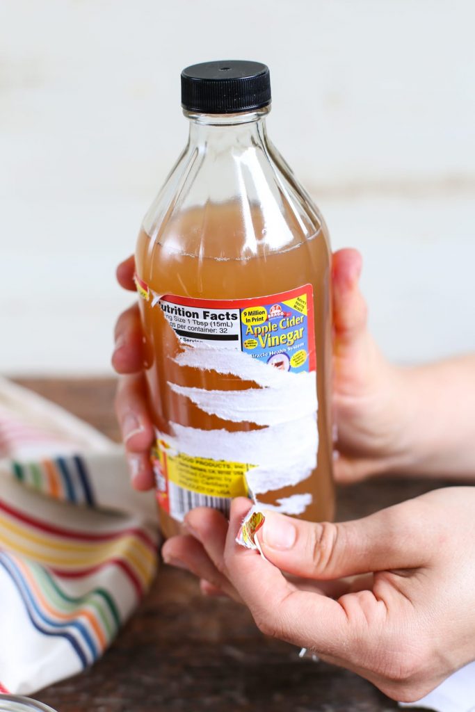 Never throw away old vinegar bottles! Rather, turn them into glass cleaning bottles for simple homemade (all-natural) cleaners. An easy tutorial that costs just pennies; plus tons of homemade cleaner recipes. How to Make A Glass Spray Bottle for Homemade Cleaners!