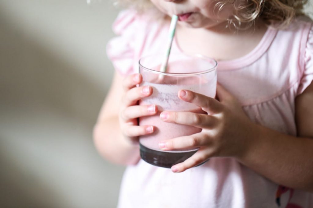 Peanut Butter and Jelly Smoothie: A healthy morning smoothie for the whole family! Made with fresh fruit, a natural sweetener, and nut butter for protein.