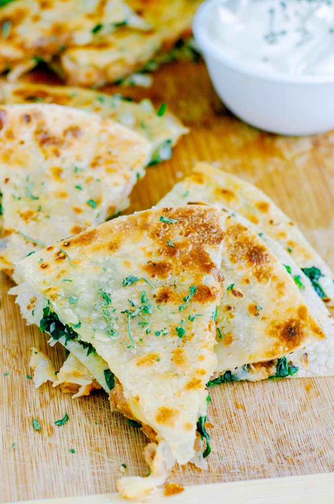 These are soooooo easy and good! Healthy, real food, vegetarian quesadillas that are packed with spinach. Such a simple meal to get dinner on the table FAST!