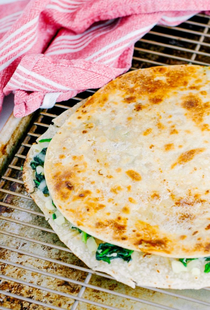 These are soooooo easy and good! Healthy, real food, vegetarian quesadillas that are packed with spinach. Such a simple meal to get dinner on the table FAST!