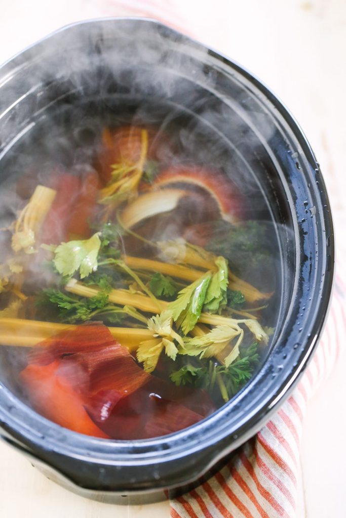 How to Make Homemade Vegetable Broth with Scraps. So easy and cheap to make with the scraps from your weekly veggies!