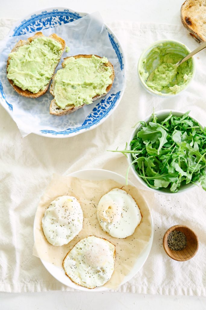 This avocado toast with egg and arugula is amazing! You can play around with herbs and spices to make a different toast each time!