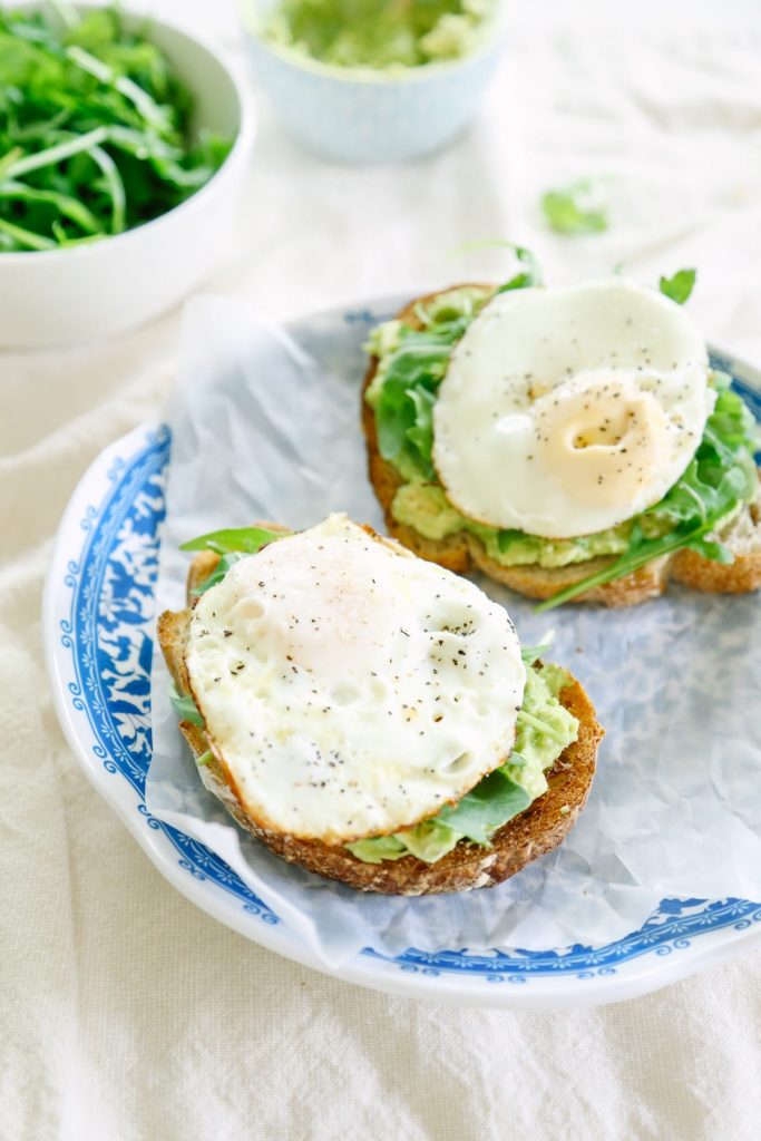 This avocado toast with egg and arugula is amazing! You can play around with herbs and spices to make a different toast each time!