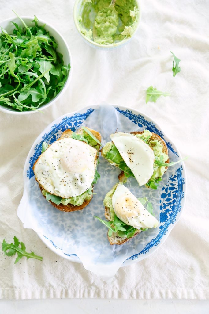 This avocado toast with egg and arugula is amazing! You can play around with herbs and spices to make a different toast each time!