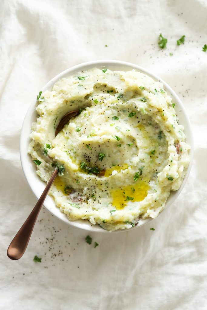 Lightened-Up mashed potatoes with herbs! So easy (no mixer required)--just add butter and olive oil, and mix. From-scratch mashed potatoes.
