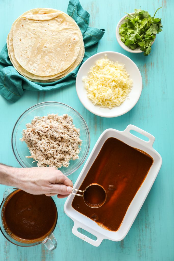 Simple homemade enchiladas made with chicken and cheese, and a homemade enchilada sauce.