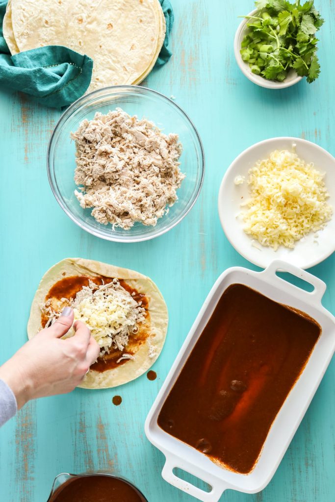 Simple homemade enchiladas made with chicken and cheese, and a homemade enchilada sauce.