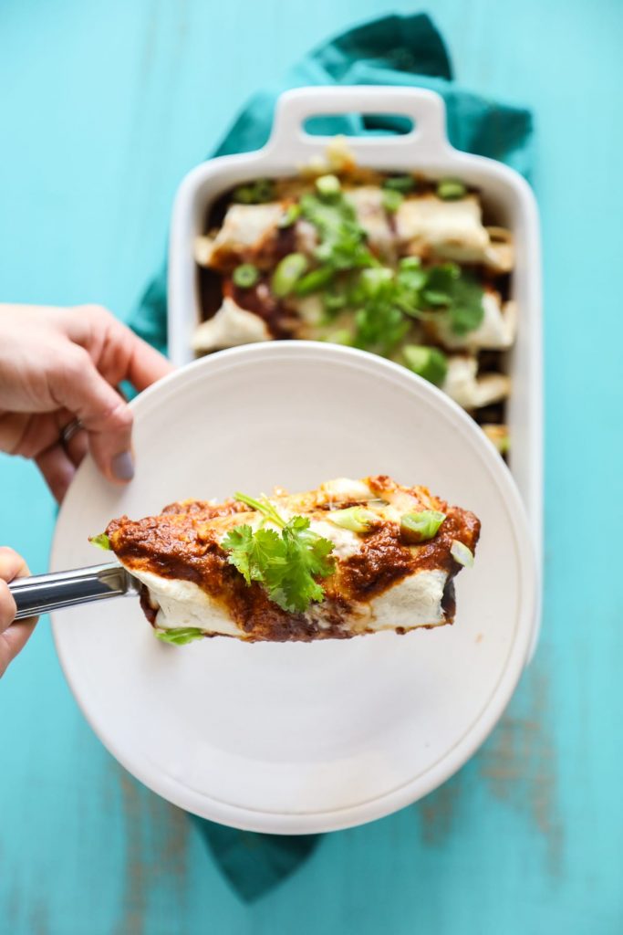 Simple homemade enchiladas made with chicken and cheese, and a homemade enchilada sauce.