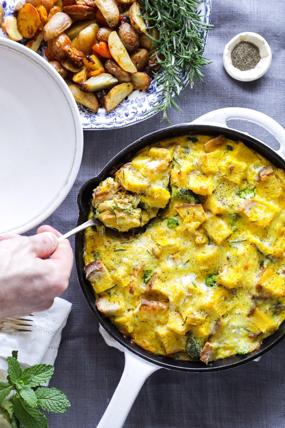 A make-ahead, one-skillet strata (egg and bread casserole) made with veggies and bacon.