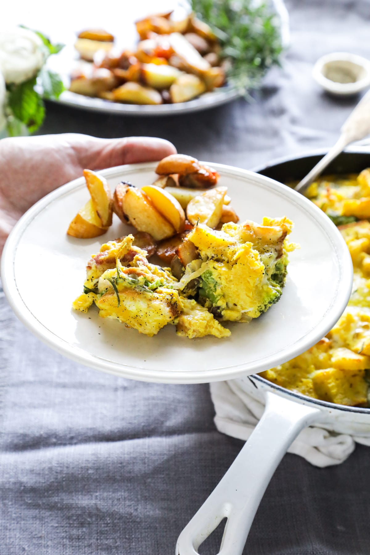 A make-ahead, one-skillet strata (egg and bread casserole) made with veggies and bacon.