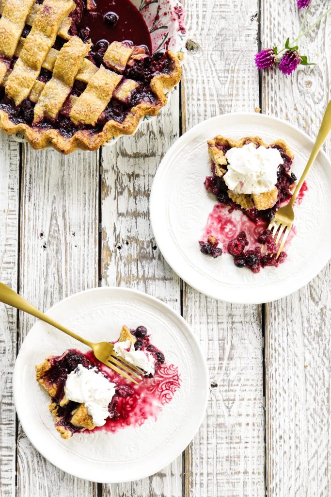 A homemade mixed berry pie featuring frozen (summer) berries and a flaky, homemade crust.