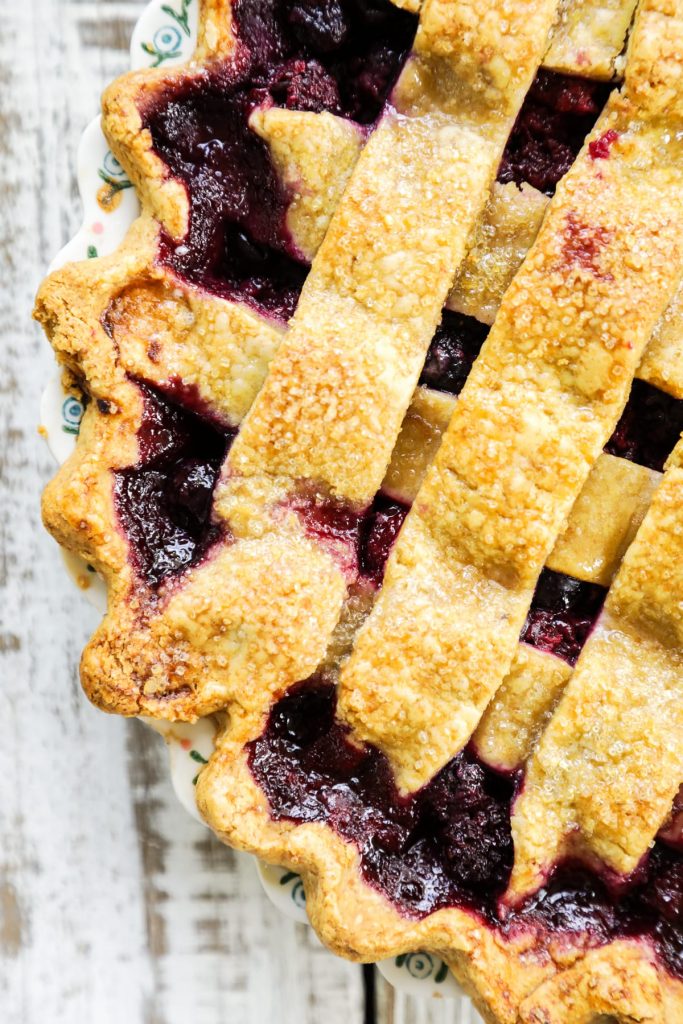A homemade mixed berry pie featuring frozen (summer) berries and a flaky, homemade crust.
