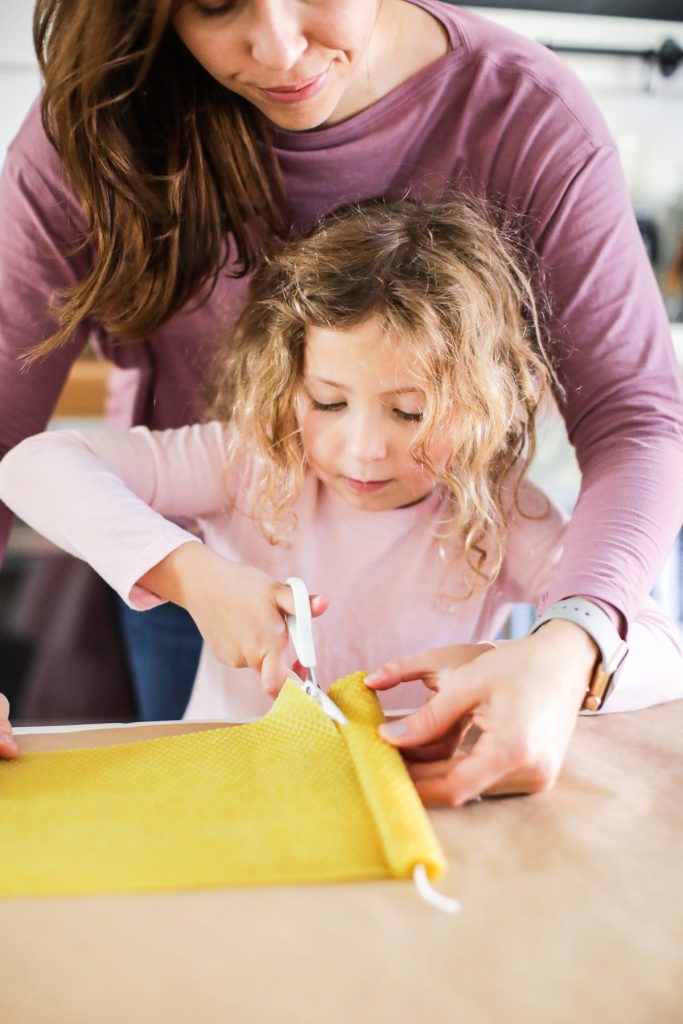 The easiest way to make beeswax taper candles. Great project for kids, too!