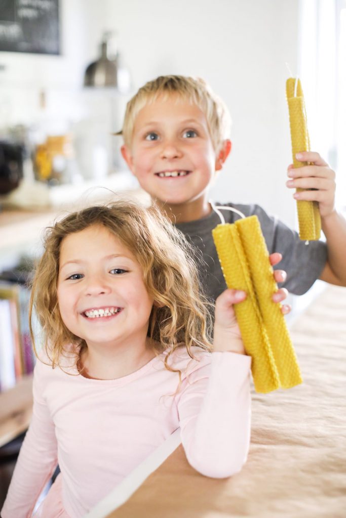 The easiest way to make beeswax taper candles. Great project for kids, too!