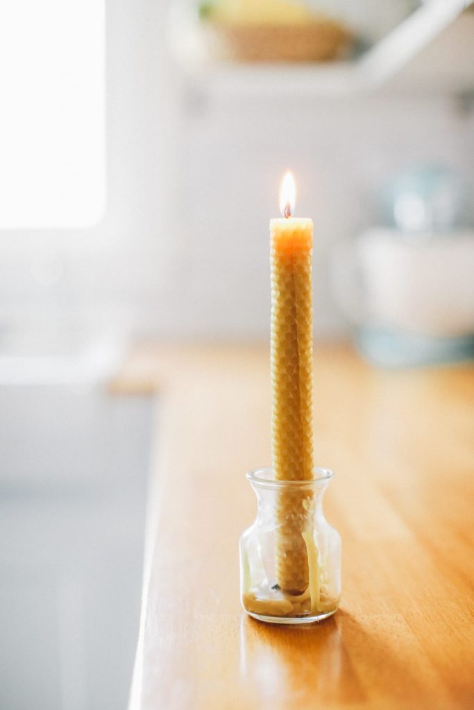 The easiest way to make beeswax taper candles. Great project for kids, too!