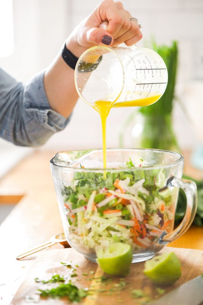 This winter slaw made with kohlrabi, cabbage, radishes, and carrots is an easy and flavorful winter side dish perfect for tacos and sandwiches!