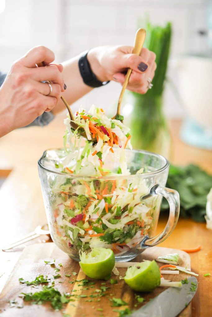 This winter slaw made with kohlrabi, cabbage, radishes, and carrots is an easy and flavorful winter side dish perfect for tacos and sandwiches!