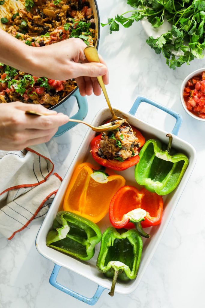 Hearty, vegetarian-stuffed peppers with a Tex-Mex-style filling of beans, rice, salsa, and taco seasonings. Make this meal for dinner, or prep the peppers in advance for a real-food lunch.