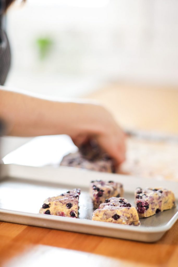 Homemade blueberry scones made with einkorn flour and naturally sweetened with maple syrup. The main sweetness and flavor comes from the lemon glaze, so don't skip it.