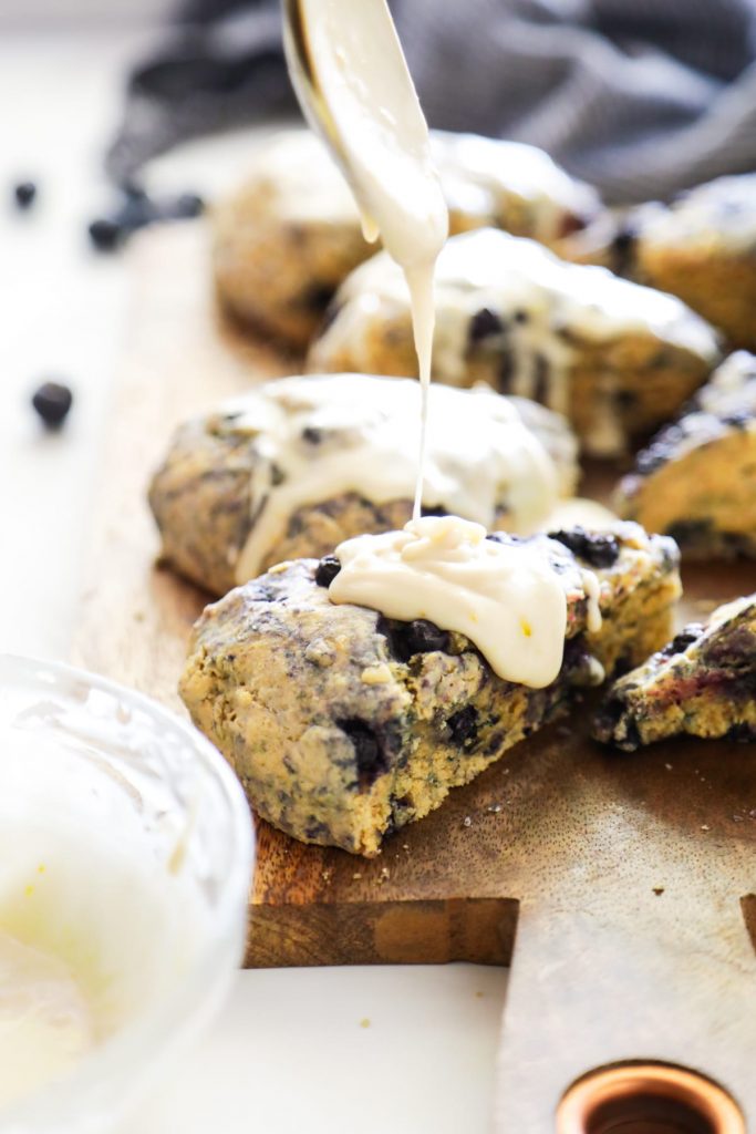 Homemade blueberry scones made with einkorn flour and naturally sweetened with maple syrup. The main sweetness and flavor comes from the lemon glaze, so don't skip it.