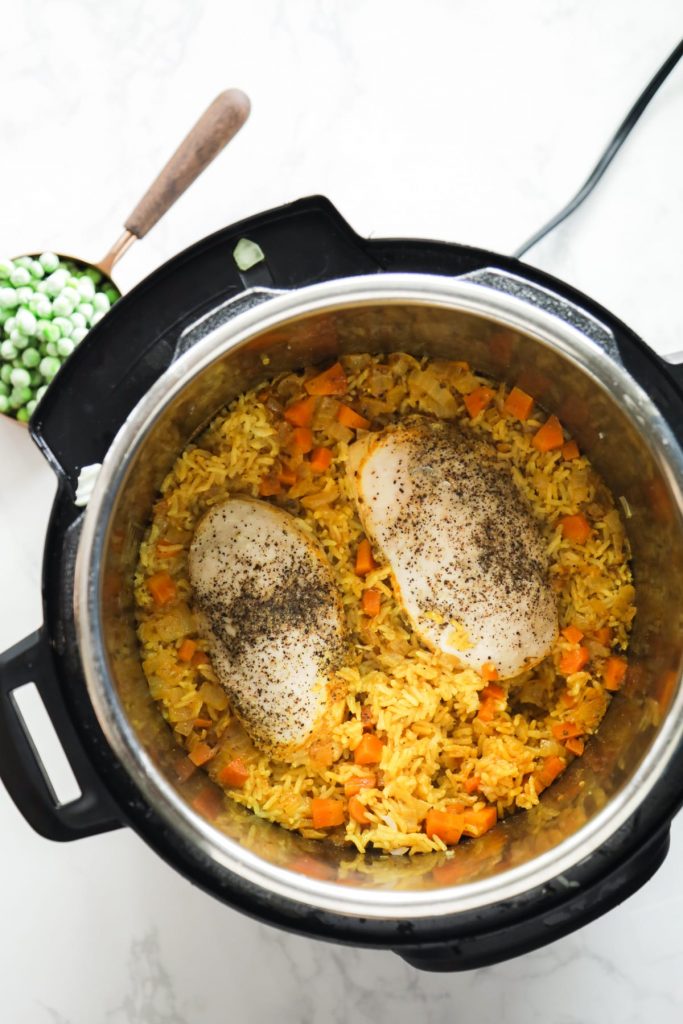 This Instant Pot chicken and rice recipe is as easy as a dinner recipe can get. It’s truly a one-pot, dump the ingredients and forget about it kind of meal.
