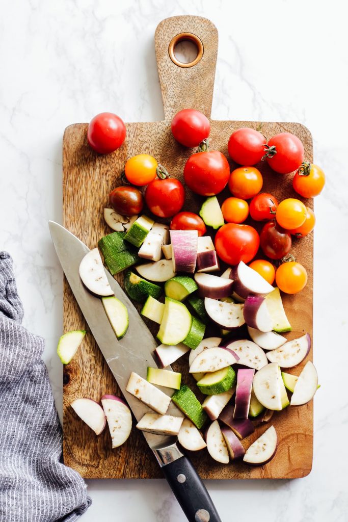 From-scratch pesto is combined with pasta, chicken, and roasted veggies for a make-ahead pasta bowl-style meal. Easy, fresh, real, and make-ahead friendly!