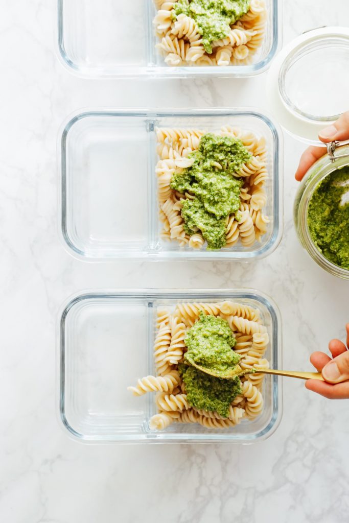 From-scratch pesto is combined with pasta, chicken, and roasted veggies for a make-ahead pasta bowl-style meal. Easy, fresh, real, and make-ahead friendly!