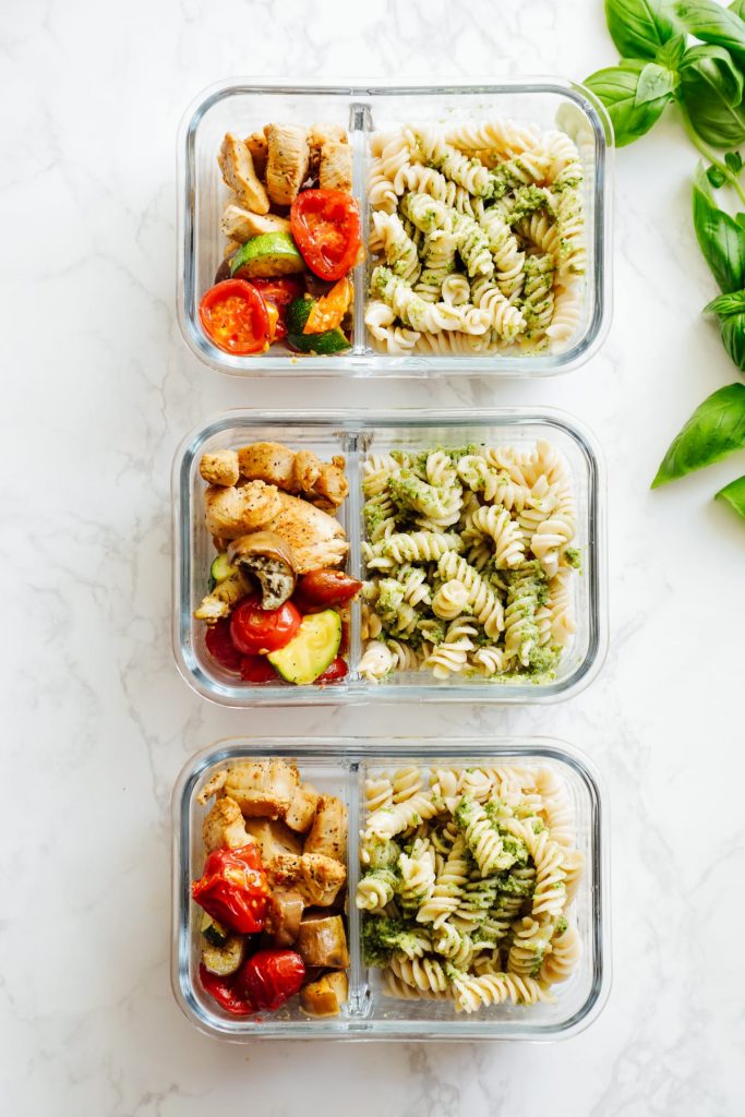 From-scratch pesto is combined with pasta, chicken, and roasted veggies for a make-ahead pasta bowl-style meal. Easy, fresh, real, and make-ahead friendly!