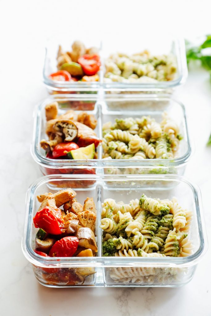 From-scratch pesto is combined with pasta, chicken, and roasted veggies for a make-ahead pasta bowl-style meal. Easy, fresh, real, and make-ahead friendly!