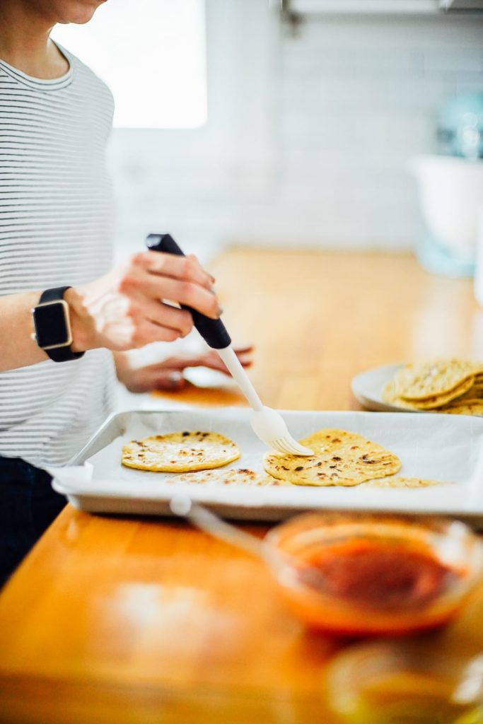 Super easy homemade pizzas made with homemade einkorn tortillas. The tortillas are freezer-friendly and taste amazing as pizza crust.