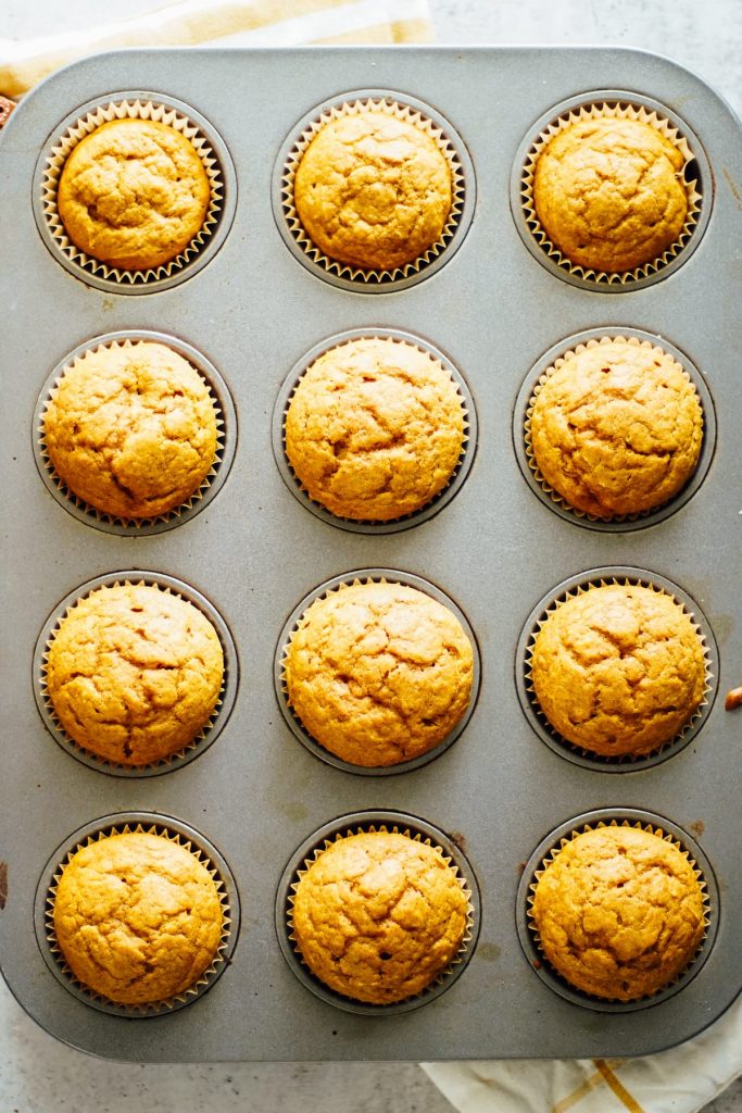 Homemade pumpkin spice muffins made with einkorn flour, pumpkin, a natural sweetener, and pumpkin pie spice.