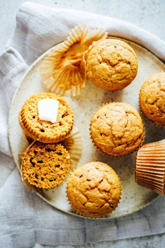 Homemade pumpkin spice muffins made with einkorn flour, pumpkin, a natural sweetener, and pumpkin pie spice.