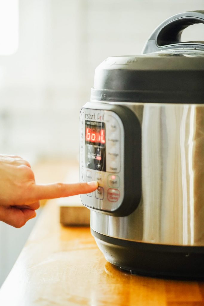 Press the yogurt setting on the Instant Pot and the + symbol until it reads "boil"