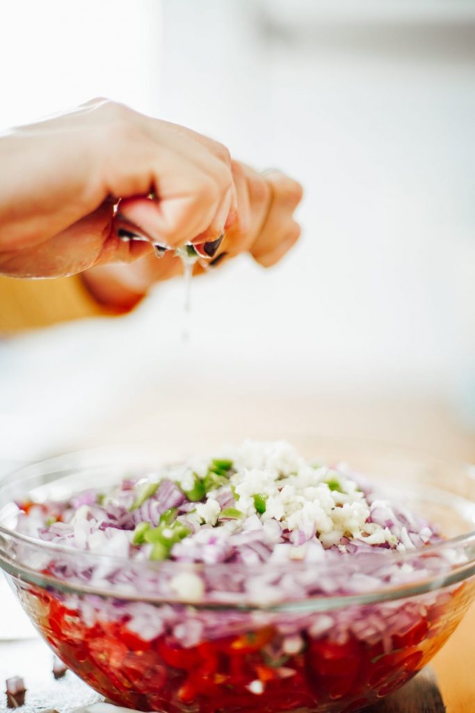 adding lime juice to salsa mixture