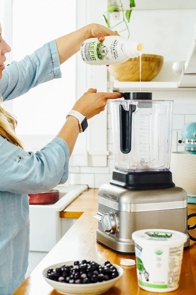 pouring yogurt into the blender