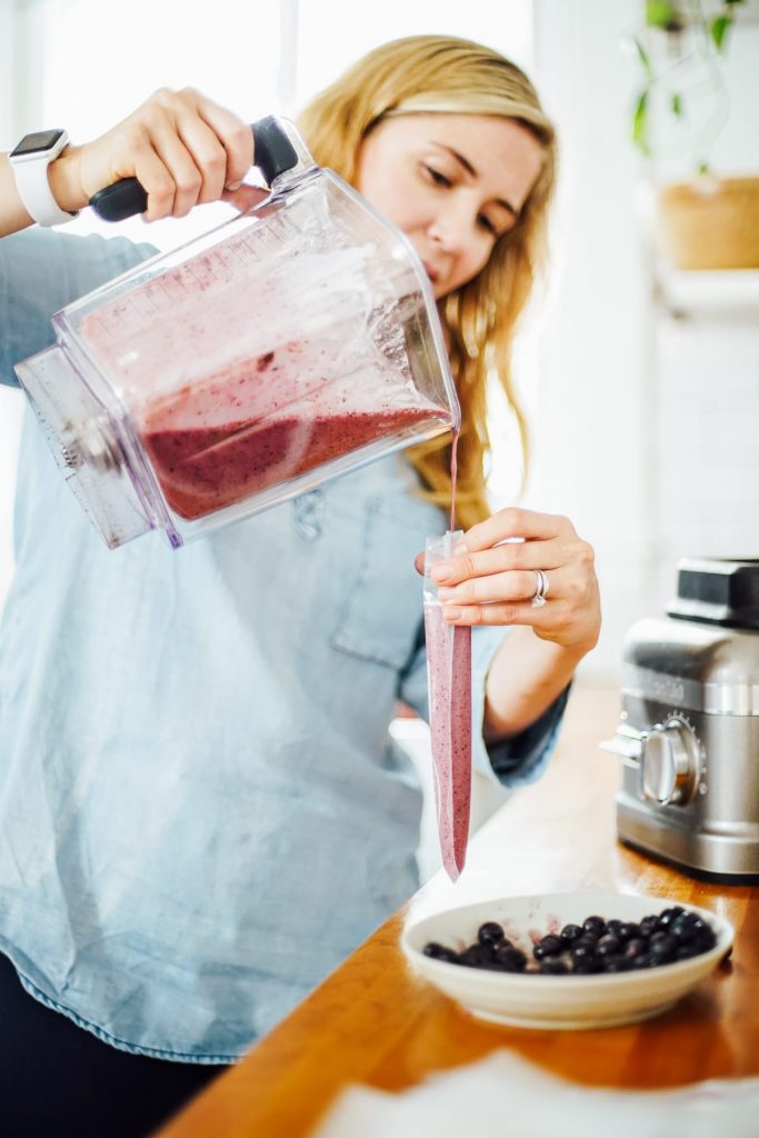 pouring the yogurt mixture into the molds