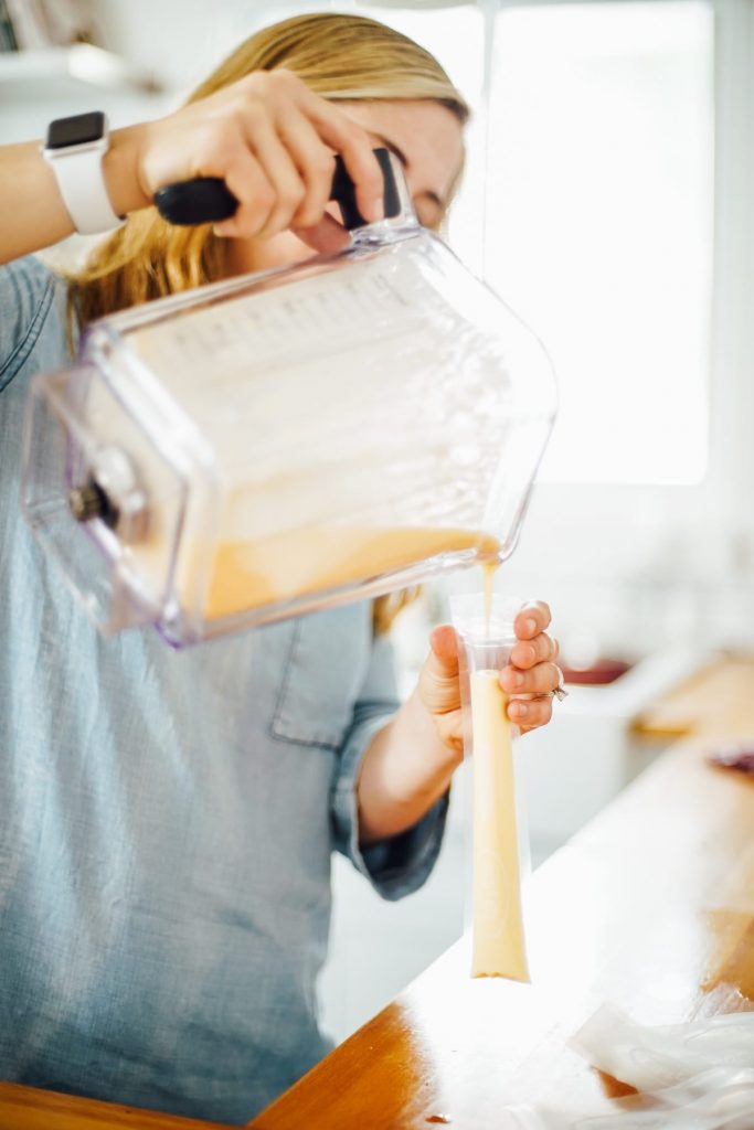 pouring the yogurt mixture into the molds