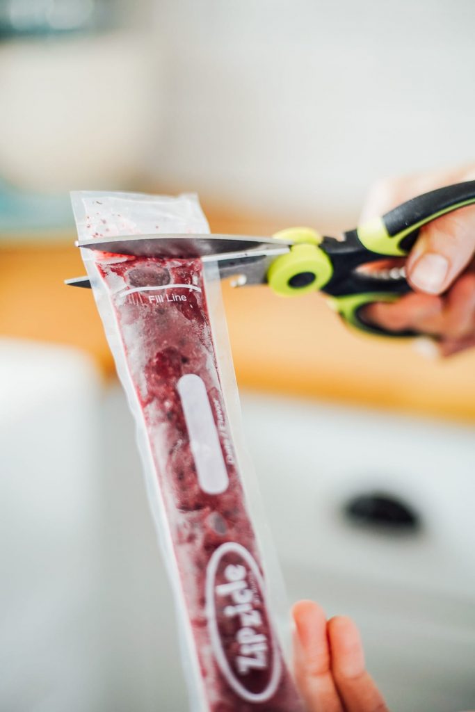 cutting a homemade yogurt stick